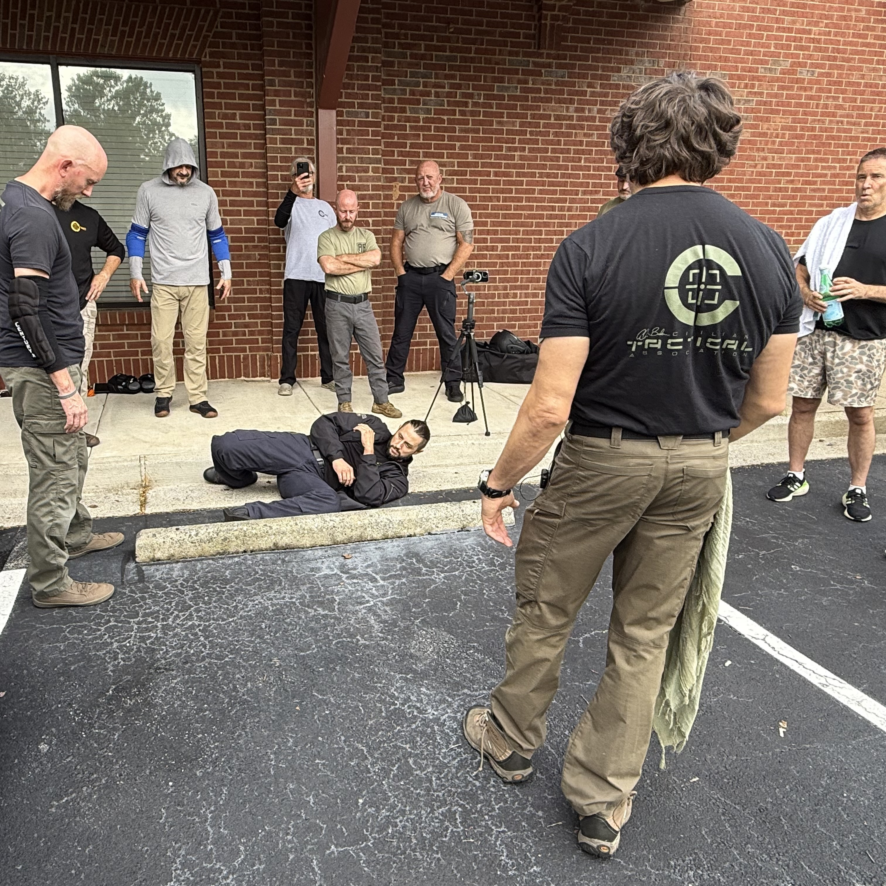 Alan Baker coaching C-Tac instructors through a parking-lot ground scenario
