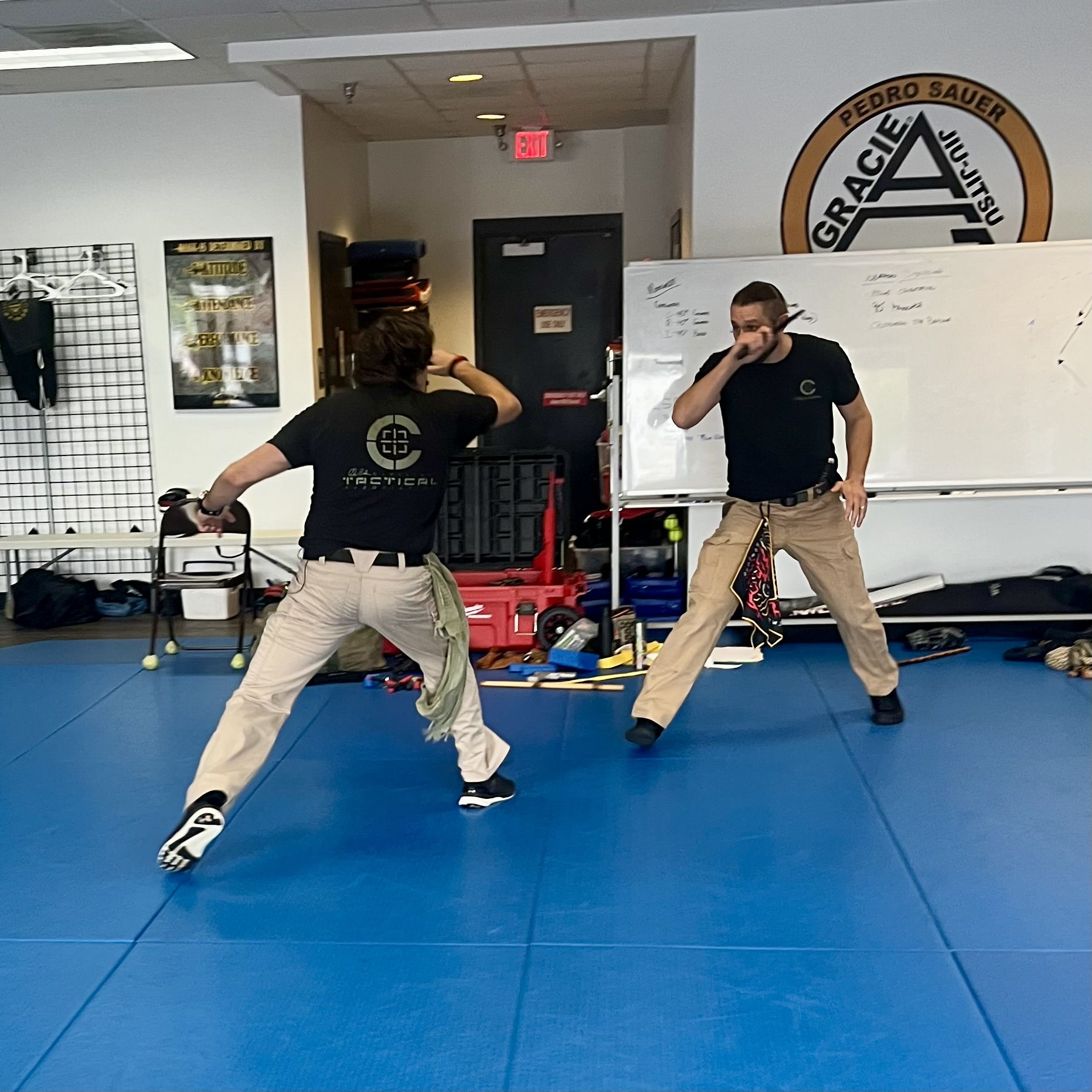 C-Tac instructors drilling movement and defensive positioning on the academy floor